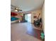 Spacious living area with kayaks mounted on the wall, leading to a backyard patio at 659 Garland Cir, Indian Rocks Beach, FL 33785