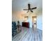 Bright office space featuring a ceiling fan, neutral walls, and modern laminate flooring at 659 Garland Cir, Indian Rocks Beach, FL 33785