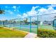 Community tennis courts with well-maintained surface and surrounded by lush landscaping at 659 Garland Cir, Indian Rocks Beach, FL 33785