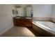 Bathroom boasts double vanities, granite counters, and a luxurious jacuzzi tub at 7330 New York Ave, Hudson, FL 34667