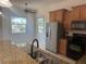 Bright kitchen featuring stainless steel appliances and natural light at 7330 New York Ave, Hudson, FL 34667