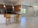 Open kitchen layout with breakfast bar and seamless flow to the living area at 7330 New York Ave, Hudson, FL 34667