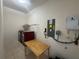 The laundry room includes appliances, a table and additional storage space at 7330 New York Ave, Hudson, FL 34667