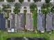 A gorgeous aerial view featuring homes, ponds, and manicured lawns in a beautiful neighborhood at 816 College Chase Dr, Ruskin, FL 33570