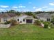 A well-maintained backyard featuring a screened porch and a lush green lawn at 816 College Chase Dr, Ruskin, FL 33570