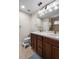 Bright bathroom with double sinks, wood cabinets, and a large mirror at 816 College Chase Dr, Ruskin, FL 33570