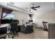 Spacious bedroom featuring a tray ceiling, natural light, and gaming setup at 816 College Chase Dr, Ruskin, FL 33570