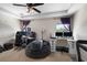 Bright bedroom featuring tray ceiling, natural light, and dual desk gaming setup at 816 College Chase Dr, Ruskin, FL 33570