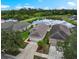 Inviting home with a picturesque pond view, surrounded by lush greenery and well-maintained landscaping at 816 College Chase Dr, Ruskin, FL 33570