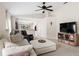 Bright living room featuring tile floors, ceiling fan, and an open floor plan at 816 College Chase Dr, Ruskin, FL 33570