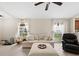 Cozy living room with tile flooring, natural light, comfortable furniture, and high ceilings at 816 College Chase Dr, Ruskin, FL 33570