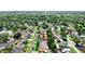 Picturesque aerial perspective of homes in a verdant neighborhood with tree-lined streets at 8315 W Elm St, Tampa, FL 33615