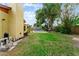 Expansive backyard featuring a pool, lush greenery, and well-maintained lawn, perfect for outdoor enjoyment at 8315 W Elm St, Tampa, FL 33615