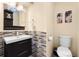 Modern bathroom featuring a stylish vanity with mosaic tile backsplash at 8315 W Elm St, Tampa, FL 33615