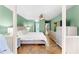 Bright bedroom with tile floors, a ceiling fan, a comfortable bed, and a dresser for ample storage space at 8315 W Elm St, Tampa, FL 33615