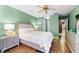 Cozy bedroom with tile flooring, featuring a comfortable bed, stylish nightstands and closet at 8315 W Elm St, Tampa, FL 33615