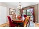 Elegant dining room with hardwood floors, a round dining table, and pool view at 8315 W Elm St, Tampa, FL 33615