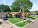 Charming single-story home with well-kept lawn, mature trees, and paved driveway at 8315 W Elm St, Tampa, FL 33615