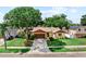 Lovely one-story house with lush green lawn, mature trees, and ample parking space at 8315 W Elm St, Tampa, FL 33615