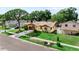 Attractive single-level home featuring a tidy front yard, healthy lawn, and paved driveway at 8315 W Elm St, Tampa, FL 33615