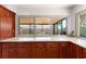 Kitchen featuring beautiful wood cabinets and large windows looking out onto the screened patio at 8315 W Elm St, Tampa, FL 33615