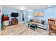 Comfortable living room with blue walls, tile flooring, and inviting furniture with natural light at 8315 W Elm St, Tampa, FL 33615