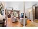 Comfortable living room with hardwood floors, a ceiling fan, and plenty of natural light from the patio doors at 8315 W Elm St, Tampa, FL 33615