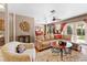 Spacious and well-decorated living room with a large sectional sofa and stylish decor leading to dining area at 8315 W Elm St, Tampa, FL 33615