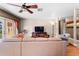 Spacious living room with a large sectional, decorative rug, and a clear view into the adjacent dining area at 8315 W Elm St, Tampa, FL 33615