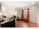 Comfortable office with desk, chair, wooden storage chest, and window at 8315 W Elm St, Tampa, FL 33615