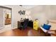 Office space featuring a desk, chair, and musician-themed wall art at 8315 W Elm St, Tampa, FL 33615