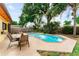 A refreshing pool with an expansive patio that offers ample seating and dining space at 8315 W Elm St, Tampa, FL 33615