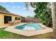 Beautiful backyard pool with ample seating and a meticulously kept patio area for outdoor living at 8315 W Elm St, Tampa, FL 33615