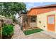 Home exterior featuring a screened patio that leads to a beautiful backyard at 8315 W Elm St, Tampa, FL 33615