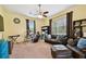 Bonus room with musical instruments, comfortable seating, and natural light at 8413 Swiss Chard Cir, Land O Lakes, FL 34637