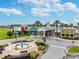 Beautiful clubhouse with a fountain in front and palm trees around, creating a welcoming community space at 8413 Swiss Chard Cir, Land O Lakes, FL 34637