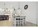 Cozy dining area with a modern table set and seamless transition to the stylish kitchen at 8413 Swiss Chard Cir, Land O Lakes, FL 34637