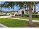 Inviting single-story home with well-maintained landscaping, a three-car garage and meticulous lawn at 8413 Swiss Chard Cir, Land O Lakes, FL 34637
