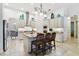 Large kitchen with a center island, seating, pendant lighting and stainless appliances at 8413 Swiss Chard Cir, Land O Lakes, FL 34637