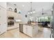 Open kitchen with a center island, stainless appliances and tile flooring at 8413 Swiss Chard Cir, Land O Lakes, FL 34637