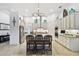Bright kitchen with a granite center island, seating, and stainless appliances at 8413 Swiss Chard Cir, Land O Lakes, FL 34637
