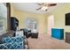 An inviting living room offers comfortable seating, carpet floors and outdoor access at 8413 Swiss Chard Cir, Land O Lakes, FL 34637