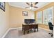 Bright office space with neutral paint, carpeted floor, ceiling fan and bright windows at 8413 Swiss Chard Cir, Land O Lakes, FL 34637