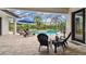 Outdoor living is at its finest on the covered patio with screened-in pool at 8413 Swiss Chard Cir, Land O Lakes, FL 34637