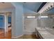 This bathroom has a vanity with double sinks and shower over tub combination at 8521 Caitlin Ct, Hudson, FL 34667