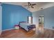 The spacious bedroom has a vaulted ceiling, hardwood floors and access to the bathroom at 8521 Caitlin Ct, Hudson, FL 34667