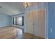 Entryway boasts tile flooring and window access to the living room with wood floors at 8521 Caitlin Ct, Hudson, FL 34667