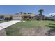 Beautiful single-Gathering home featuring a brick exterior, well-manicured lawn and mature landscaping at 8521 Caitlin Ct, Hudson, FL 34667