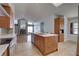 Open concept kitchen with a large island, modern cabinetry, and stainless steel appliances at 8521 Caitlin Ct, Hudson, FL 34667
