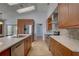 Updated kitchen featuring stainless appliances, stone countertops, and lots of natural light at 8521 Caitlin Ct, Hudson, FL 34667